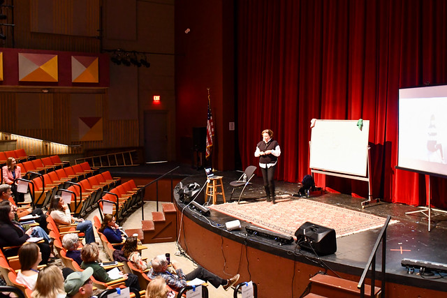 Instructor presenting on stage at BCC